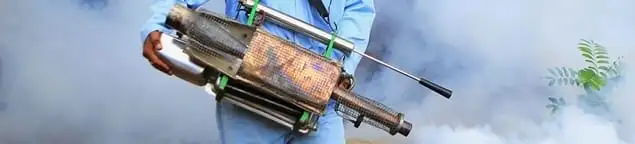Fumigation technician using a fogger for deep pest treatment in Tulsa, OK